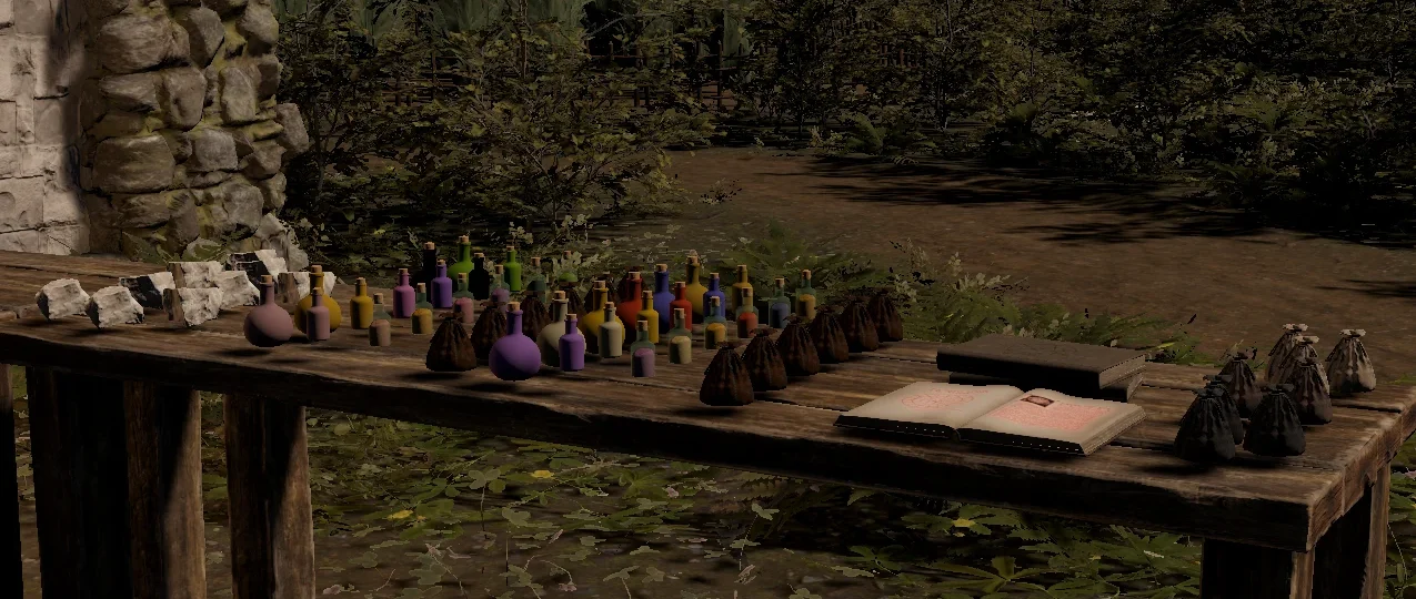 A wooden table outdoors covered in potion bottles of every color, small sacks, stones and an open book